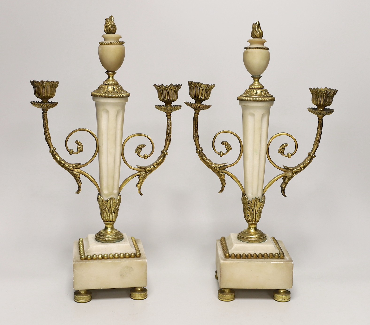 A pair of 19th century French alabaster and gilt metal mounted candelabra, 36cm